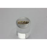 A diamond five-stone ring set with graduated old cuts in 18ct gold