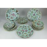 A collection of Chinese porcelain plates decorated with birds, butterflies and flowers on celadon