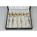 A cased set of six Danish silver gilt and harlequin enamel coffee spoons by Meka, marked sterling