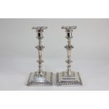 A pair of Victorian silver column candlesticks, makers Hawksworth, Eyre & Co Ltd, Sheffield 1894, of