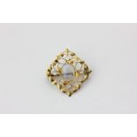 A gold mounted moonstone brooch in Tiffany style