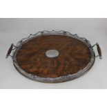A silver plate mounted oval oak tea tray with gallery, two handles and monogrammed plaque