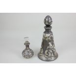Two 19th century white metal overlay glass scent bottles, (a/f)