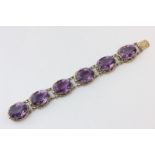 A Continental silver gilt and amethyst six stone bracelet