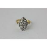A diamond cluster ring, the nine stones pave set in 18ct gold
