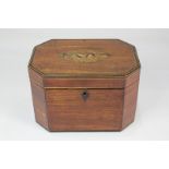 A George III mahogany tea caddy with inlaid floral design, canted corners and two zinc lined