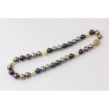 A mixed colour pearl necklace on a textured 9ct gold ball clasp