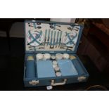 A Brexton picnic hamper retailed by Harrods, with blue chequered design, fitted contents for six, to