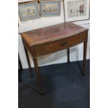 An Edwardian mahogany bow front desk with red leather inset top over single drawer, on tapered legs,