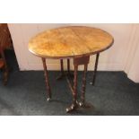 A burr walnut oval Sutherland table on turned legs, 66cm by 53cm extended