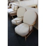 A pair of light Ercol stick-back armchairs