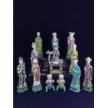 A collection of twelve Chinese porcelain Qianlong figures to include the eight immortals, each