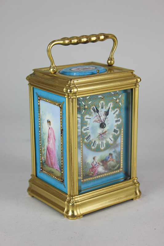 A 19th century French brass cased carriage clock, with Sevres style porcelain panels decorated