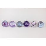 Six Caithness glass paperweights, 'Sirocco', 'Tempest', 'Vortice', 'Ribbons', 'Moonflower', and '