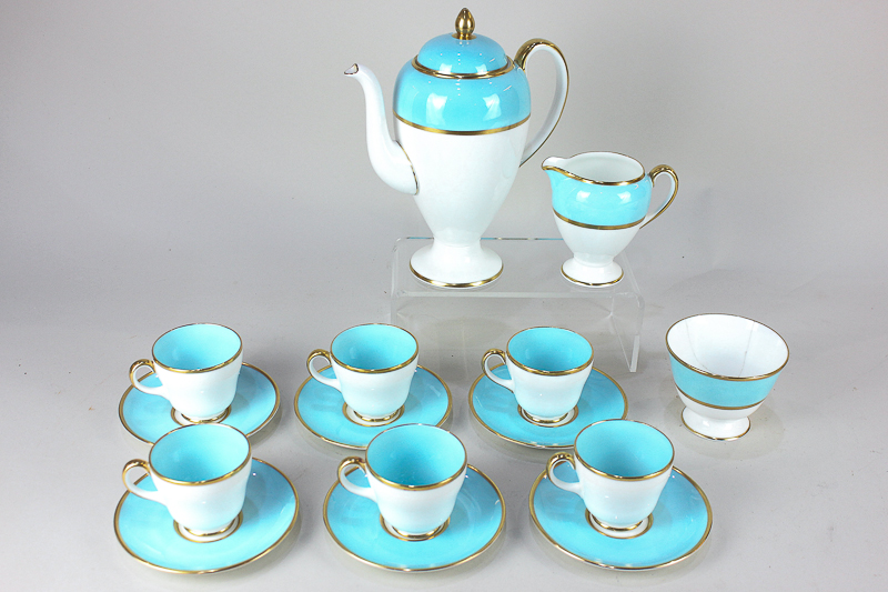 A Wedgwood porcelain coffee set for six in blue and white with gilt borders, comprising coffee