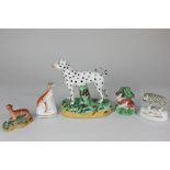 Five Staffordshire pottery models of animals including a leopard, a pearl ware calf with bocage