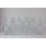 A set of four Brierley cut glass spirit decanters and a pair of Brierley port decanters