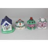 Four Staffordshire pottery cottages, one as a money box and two as incense burners