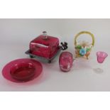 A small collection of cranberry glass to include a mug painted with a figure dressed in white and