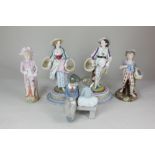 A Nao porcelain figure group of a boy and girl seated on a bench, a Rudolstadt Volkstedt porcelain