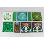 A collection of nine Art Nouveau tiles, to include two Minton Hollins & Co tiles decorated with