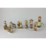 Eight Goebel porcelain Hummel figures of children, including 'We Congratulate', 'Retreat to Safety',