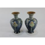 A pair of Royal Doulton baluster vases, with Art Nouveau overlaid design, possibly by E. Banfield,