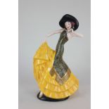 A Crown Devon porcelain figure of a flamenco dancer with yellow frilled skirts, 31cm high