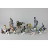 Twelve Goebel porcelain models of birds, including Blue Titmouse, Nuthatch, Crested Tit, and