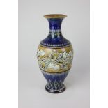 A Doulton Lambeth stoneware vase by Eliza Simmance, decorated with a border of flowers in raised