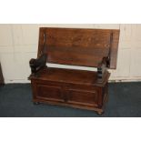 A 20th century oak monks bench, with hinged back and seat, on bun feet, 108cm