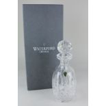 A Waterford crystal decanter, of slender barrel shaped form, with large globular stopper, 27cm high,