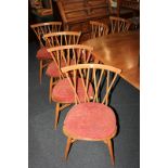 A set of six Ercol cross stick back dining chairs, on tapered legs with X frame spindle supports