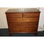 A 19th century oak chest of two short over three long graduated drawers with brass drop handles,