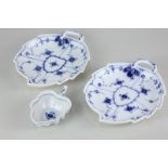A pair of Royal Copenhagen blue and white floral porcelain leaf shaped dishes, 18.5cm, together with