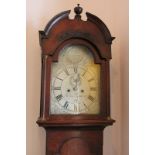 A George III oak longcase clock, the 12 inch domed silverised dial with engraved shell spandrels, by