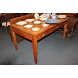 An oak library table, with rectangular crossbanded top, above one long and one short drawer with