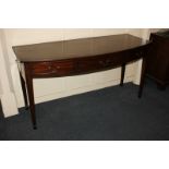 A reproduction mahogany bow front sideboard, with cross banded top above two short and one long