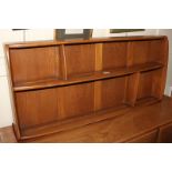 An Ercol three tier wall mounted plate rack / shelf unit, with makers label, 107cm