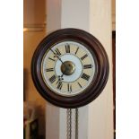 A Victorian 'postman's' alarm wall clock, the circular dial with Roman numerals, 26.5cm diameter