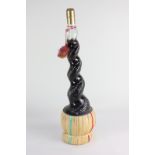 A bottle of Chianti red wine with spiral bottleneck in wicker stand, 51cm high