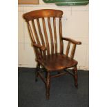 A farmhouse kitchen chair with curved slatted back and scroll arms, on turned supports and legs