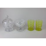 A pair of Uranium cut glass vases, a circular cut glass sweets jar and cover, and a cut glass