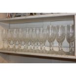 A collection of champagne flutes including a set of fourteen, a set of twelve, a set of eleven, a