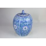 A Chinese porcelain ginger jar and cover, ovoid shaped with pink, green and white floral
