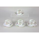 Four Royal Crown Derby porcelain coffee cups and saucers decorated with pink roses and trailing