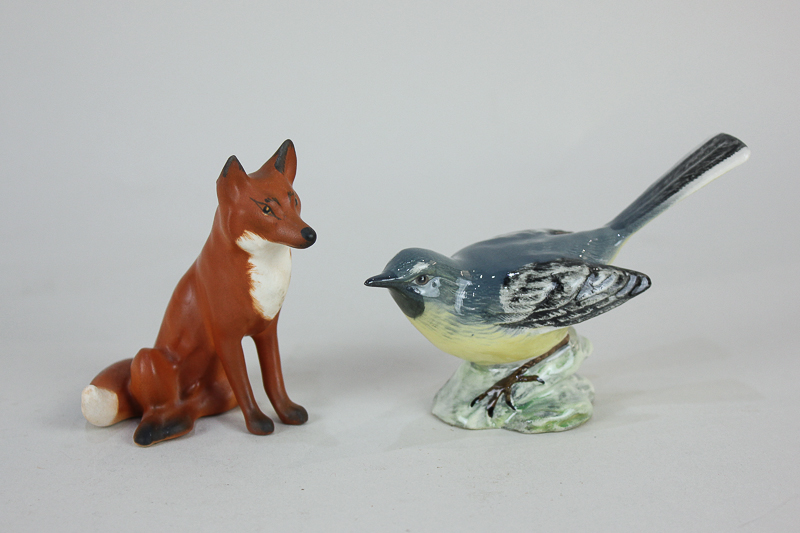 A Beswick porcelain model of a grey wagtail, 7cm, and another of a seated fox, 7cm