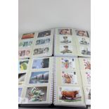 Two albums containing Royal Mail stamp card series PHQ's 1985-1996 postcards