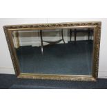 A modern rectangular gilt framed wall mirror, bevelled mirror plate 54cm by 84.5cm