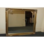 A gilt framed rectangular wall mirror, 59cm by 69cm